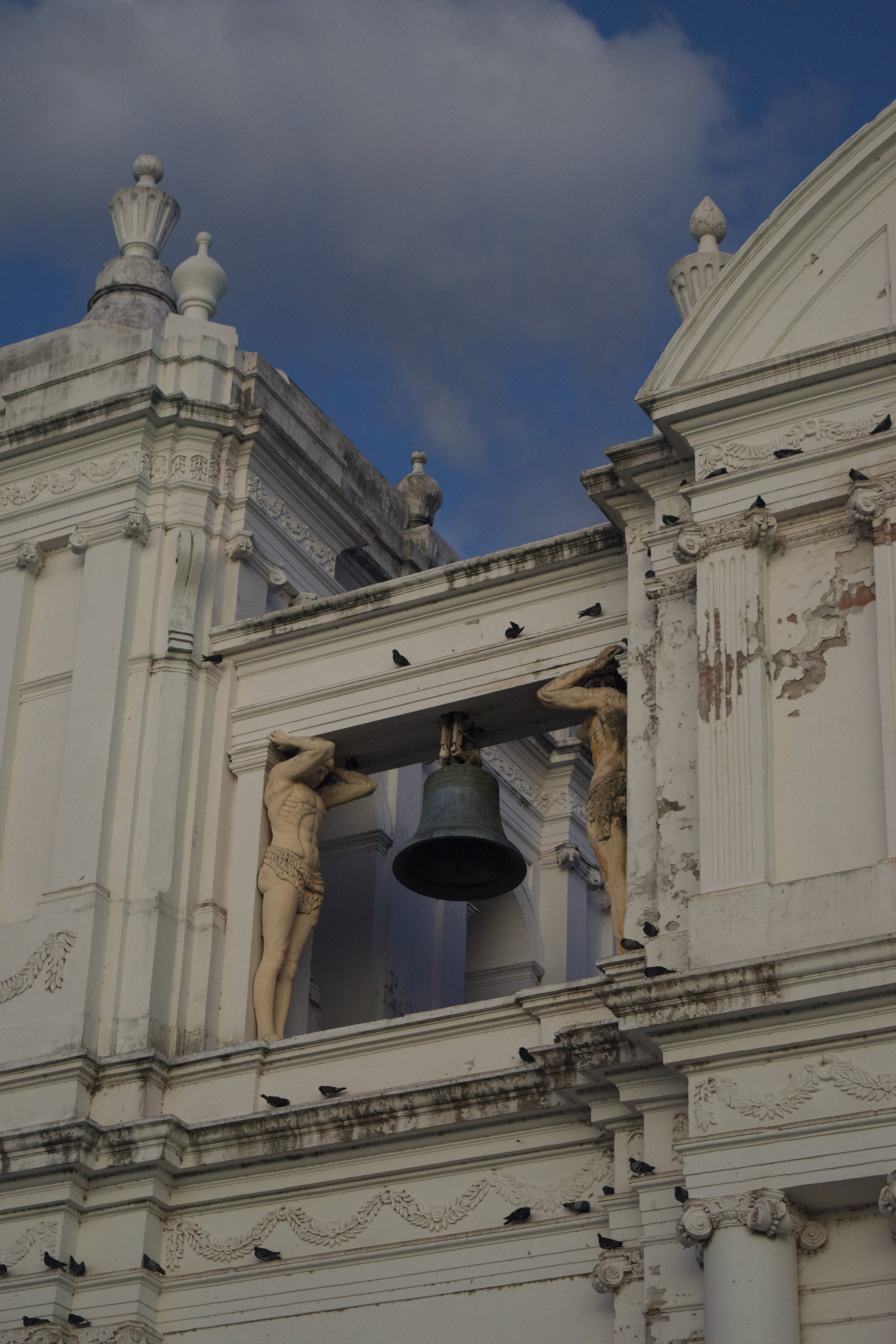 A bell suspended between two spires