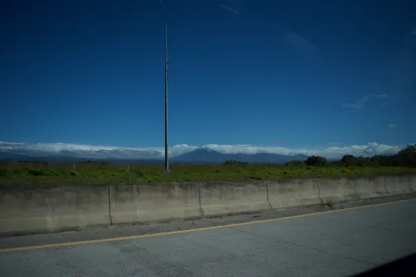 The view from a highway looking out at mountains