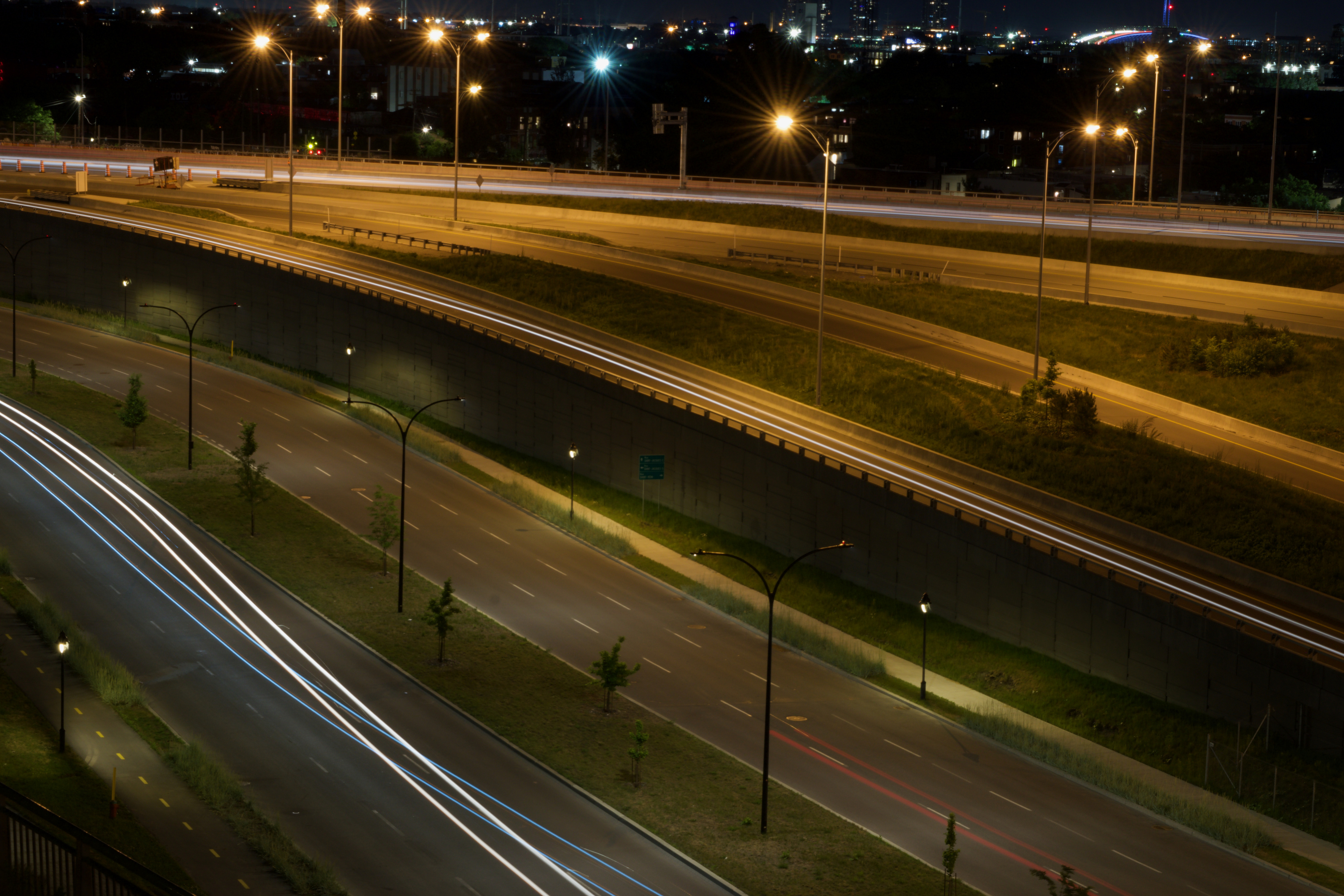 A slow shutter speed image of cars driving creating light trails