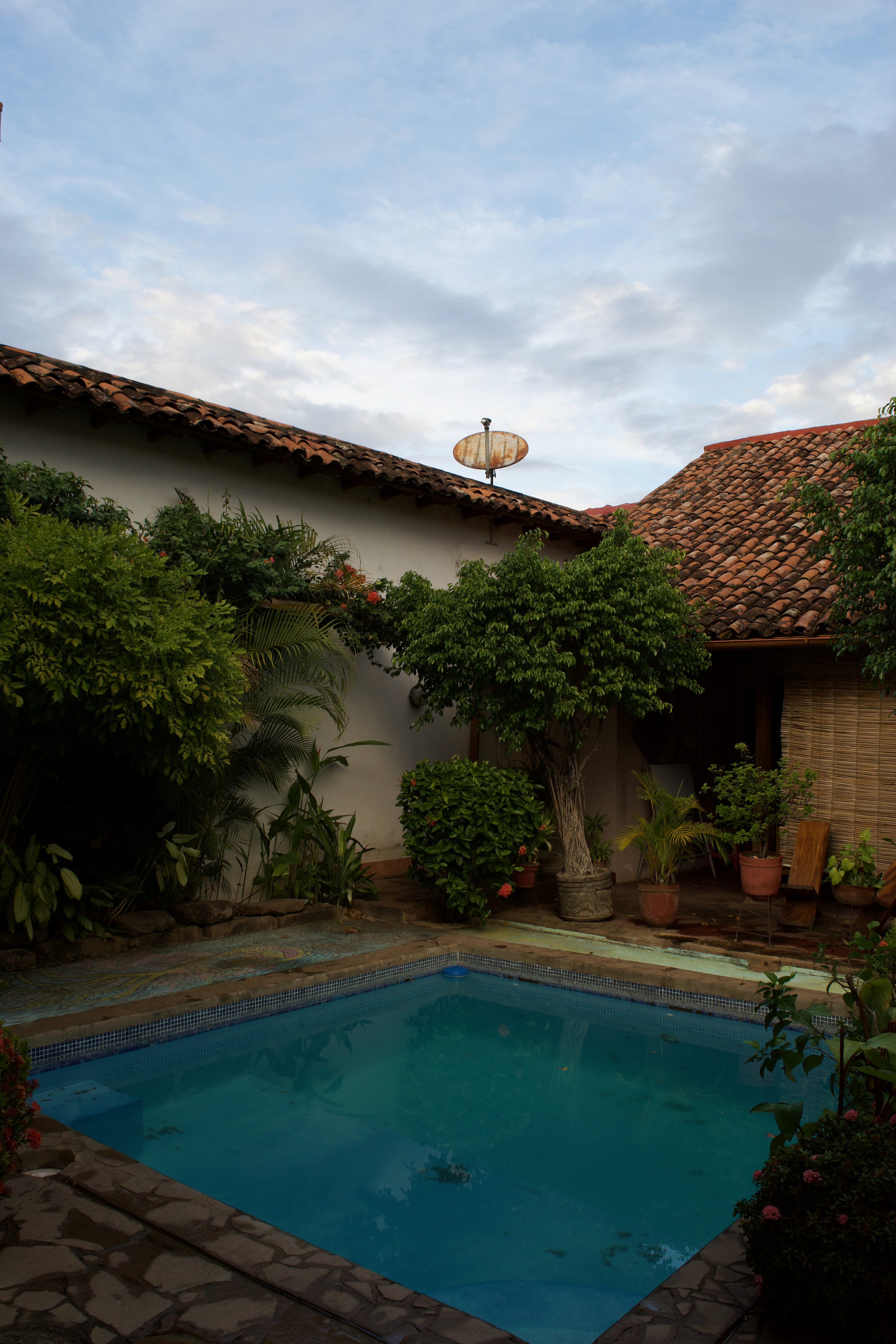 A pool inside of a colonial courtyard