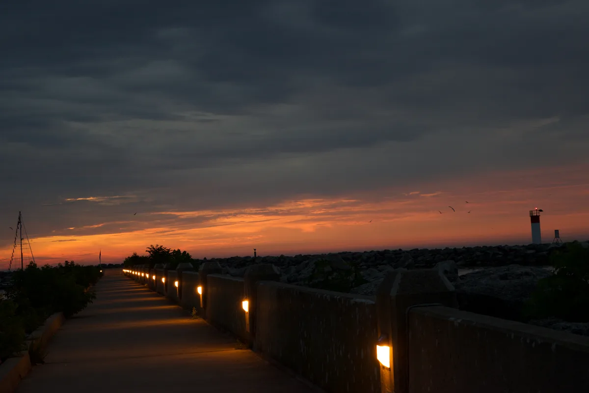 A path with lights during sunset