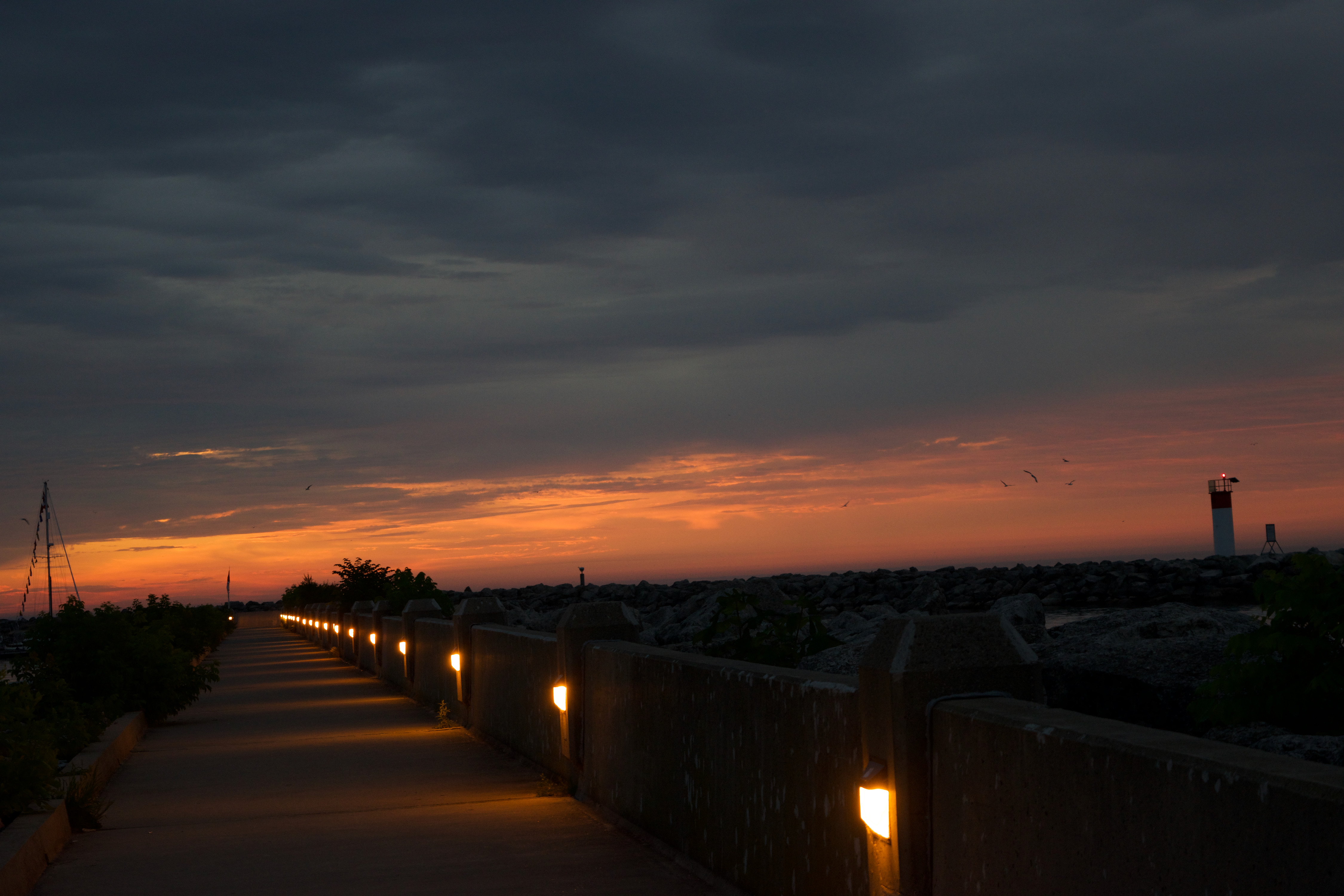 A path with lights during sunset